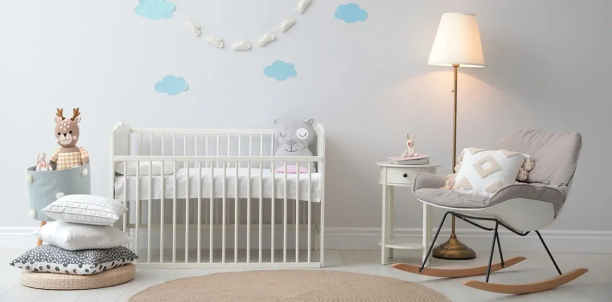 Stylish baby room interior with floor lamp and rocking chair